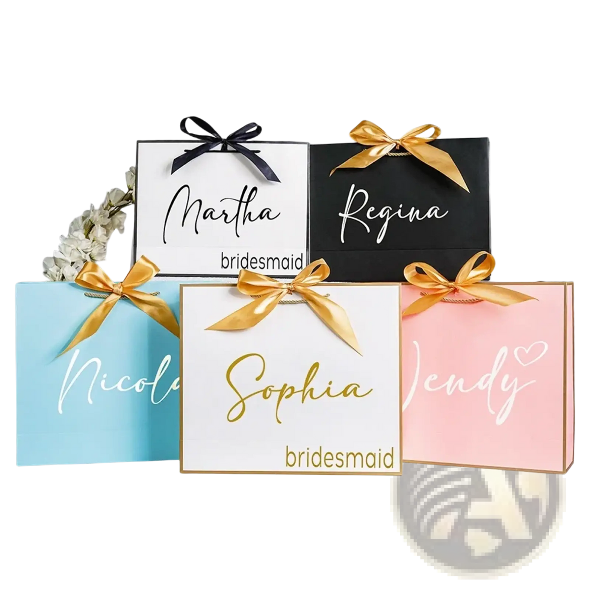 Personalized bridesmaid gift bags in pastel and black with gold and white cursive names tied with satin bows