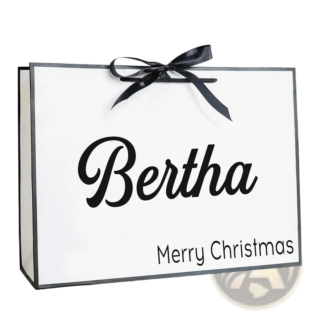 White personalized bridesmaid gift bag with black cursive name and merry christmas tied with glossy black ribbon