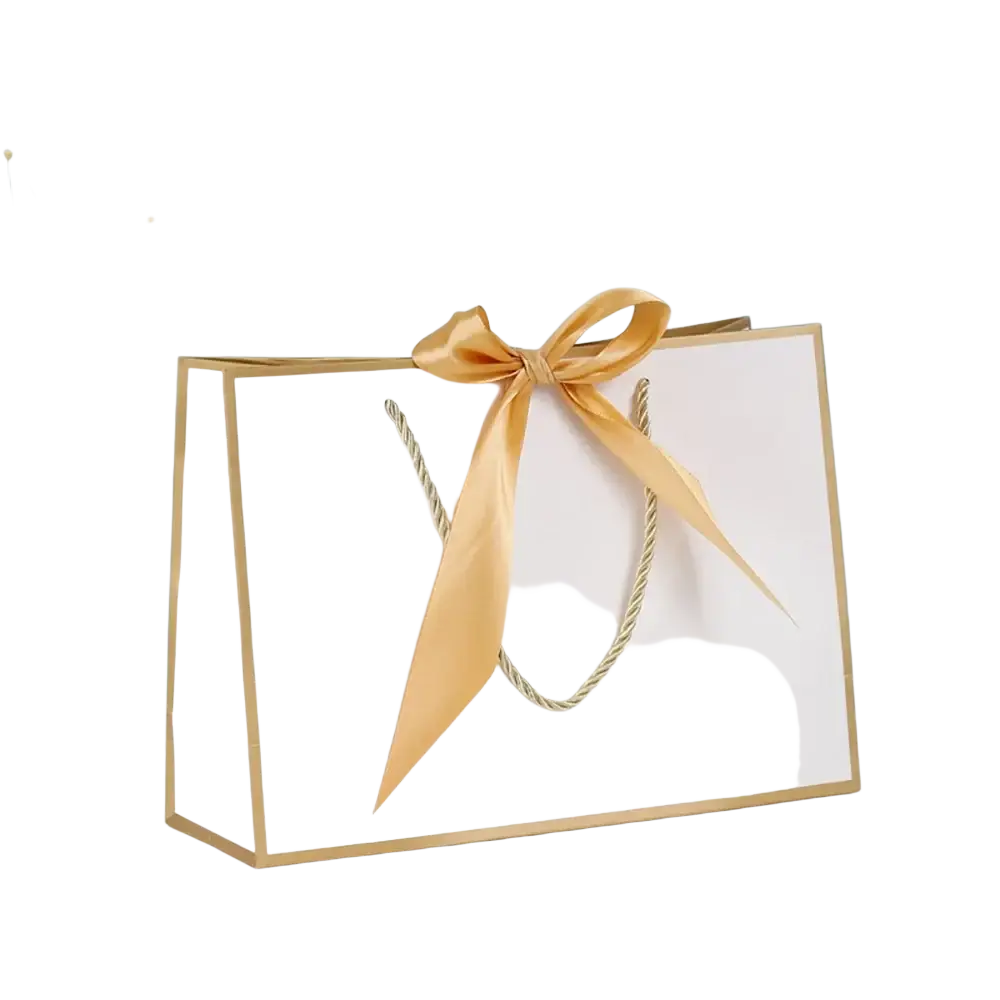 White paper bridesmaid gift bag with gold trim and golden satin ribbon bow personalized with custom name