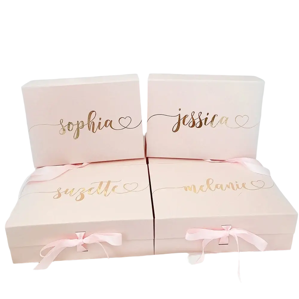 Pink personalized bridesmaid proposal gift boxes with gold foil names and matching ribbon closures