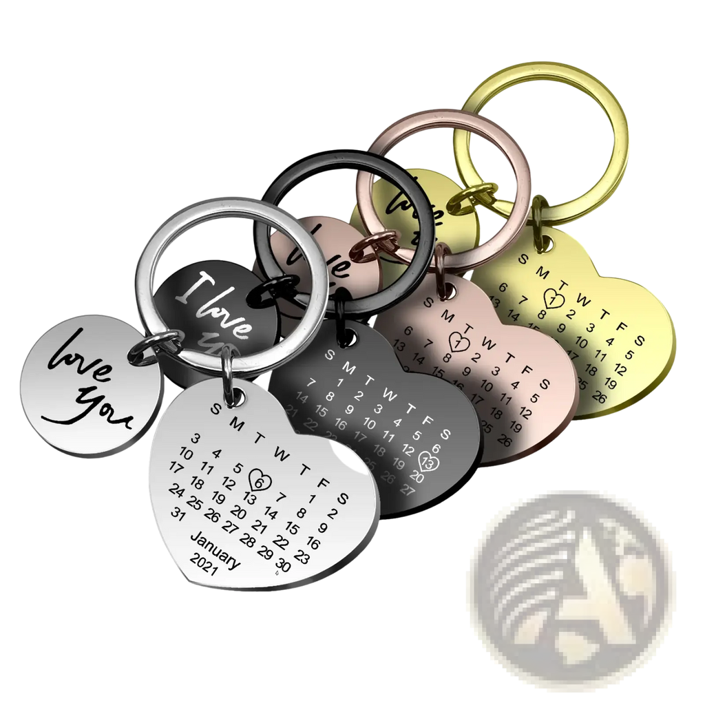 Set of heart-shaped stainless steel personalized calendar keychains with engraved dates and i love you in multiple finishes