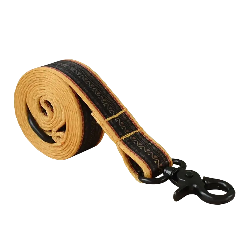 Tan woven leash with black patterned trim and black metal clasp in personalized dog collar set fits neck size