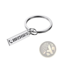 Silver rectangular personalized engraved metal anti-lost keychain with phone number and icon visible on the front side
