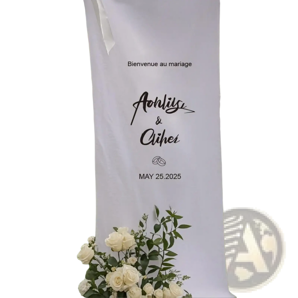 Personalized white fabric wedding welcome sign with black cursive script and custom date banner for wedding decor