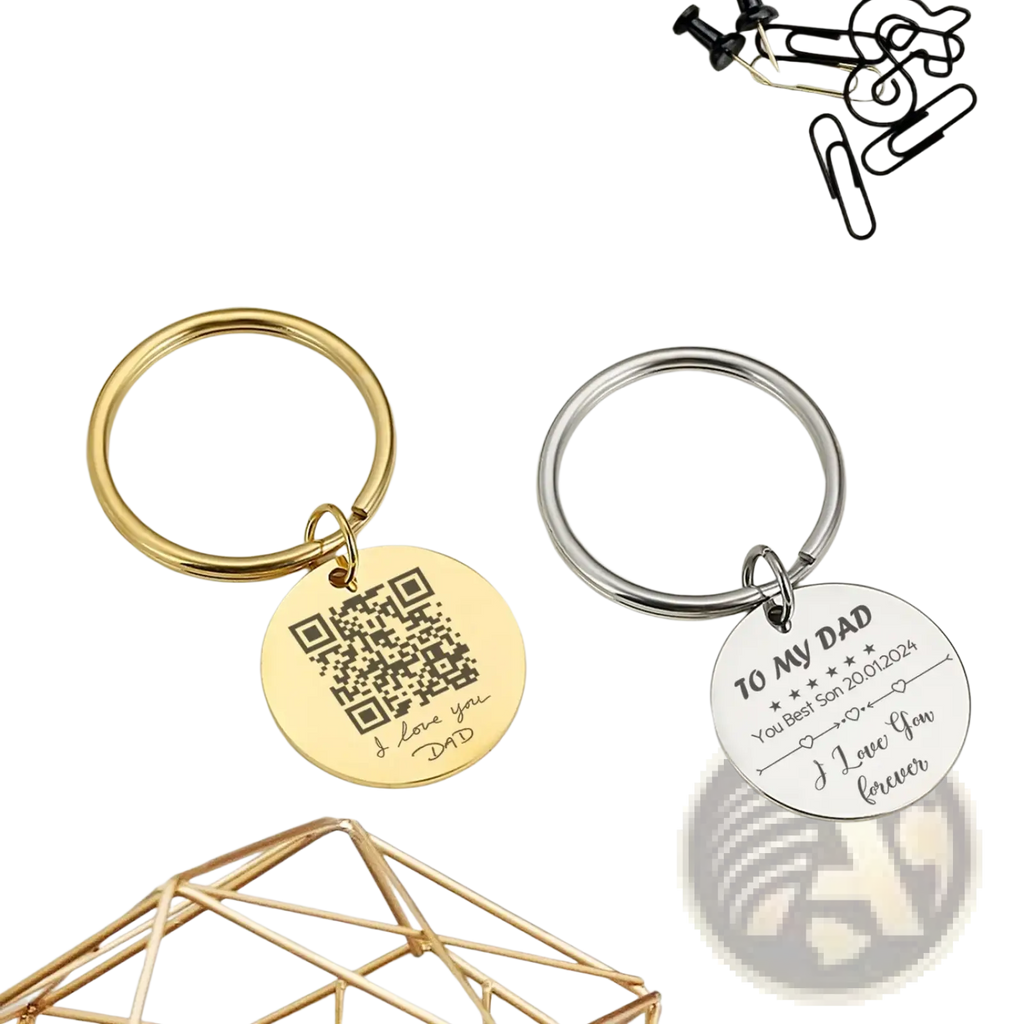 Two personalized fingerprint QR code keychain gifts with gold and silver circular metal charms featuring engravings