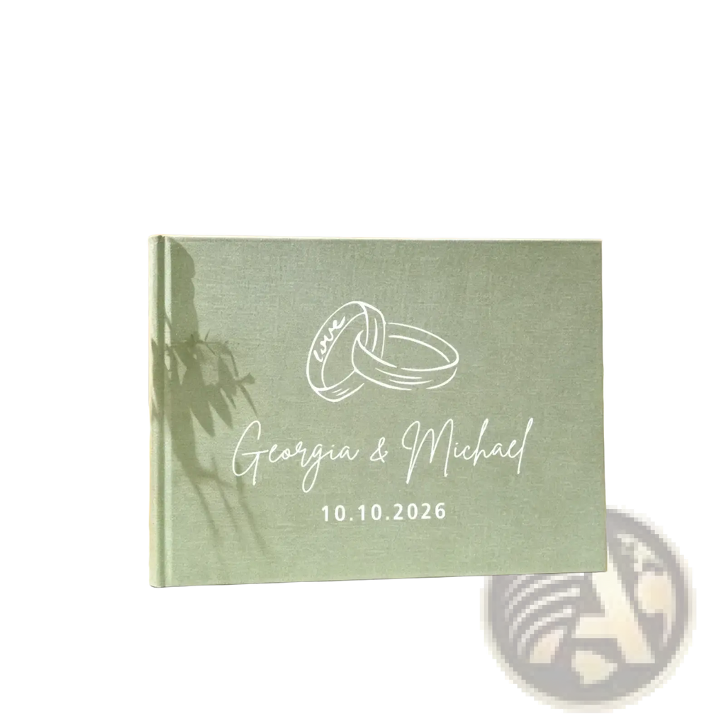 Personalized green linen wedding guest book with mint green textured cover and engraved interlocking rings and names