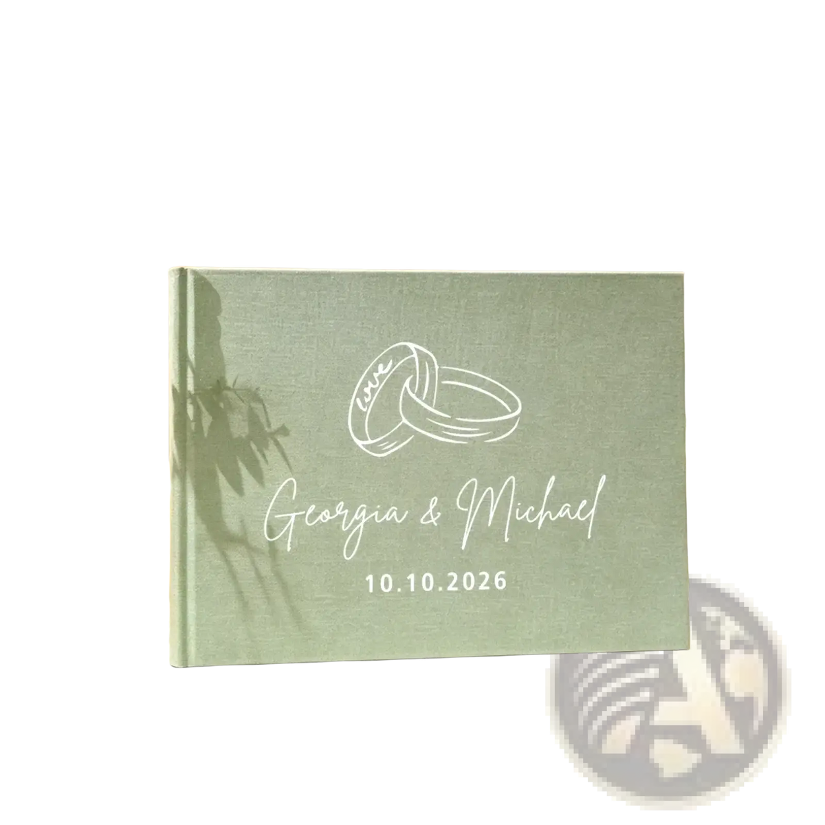 Personalized green linen wedding guest book with mint green textured cover and engraved interlocking rings and names