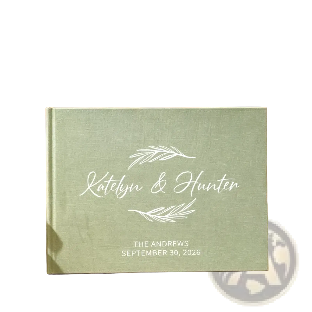 Personalized green linen wedding guest book with mint green linen texture white engraved names and leaf designs