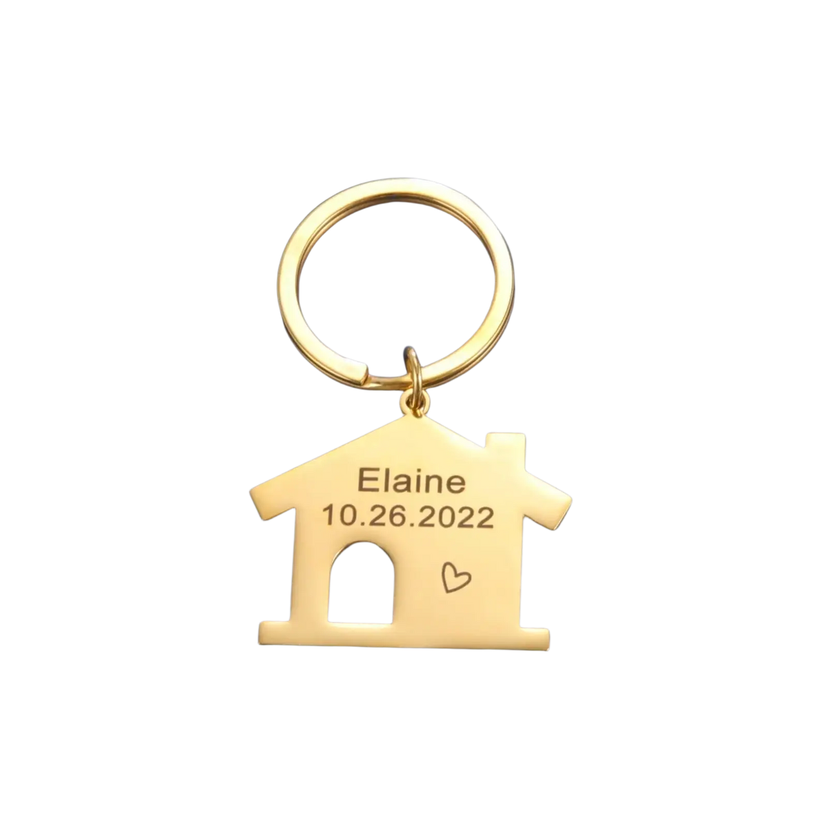 Gold-colored house keychain made of metal with engraved name and date personalized as custom couple gift