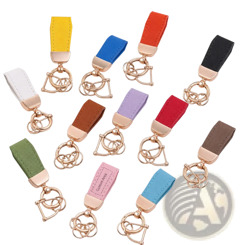 A collection of colorful personalized leather keychains with rose gold metal hardware and interlocking ring design