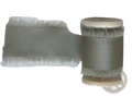 Sage-colored frayed-edge ribbon wound on a spool for personalized minimalist wedding letter books set packaging