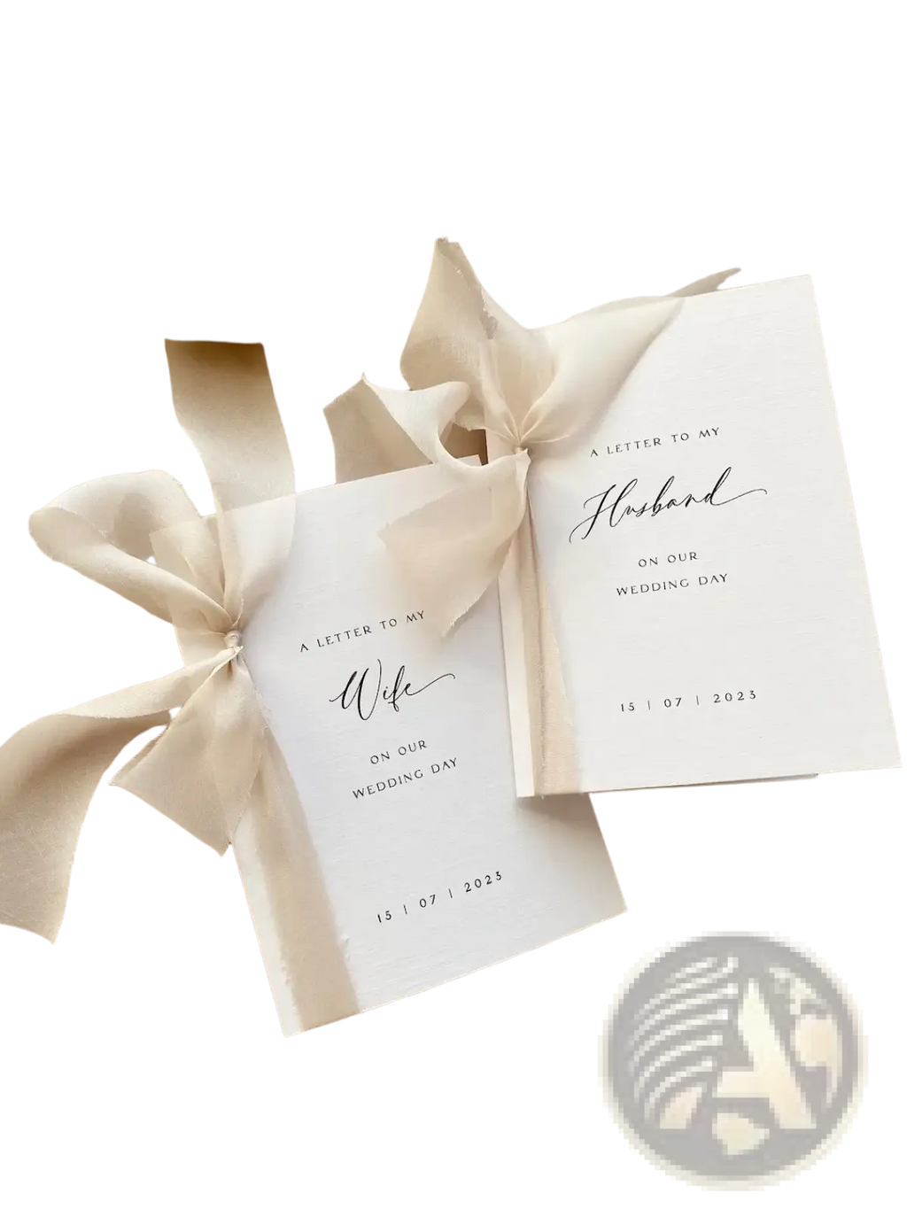 Two elegant white minimalist wedding letter books set tied with cream ribbon and featuring black calligraphy