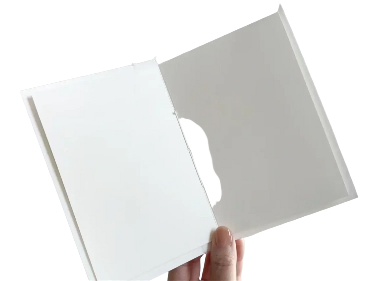 Personalized minimalist wedding letter books set featuring a white notebook with smooth, unlined interior pages