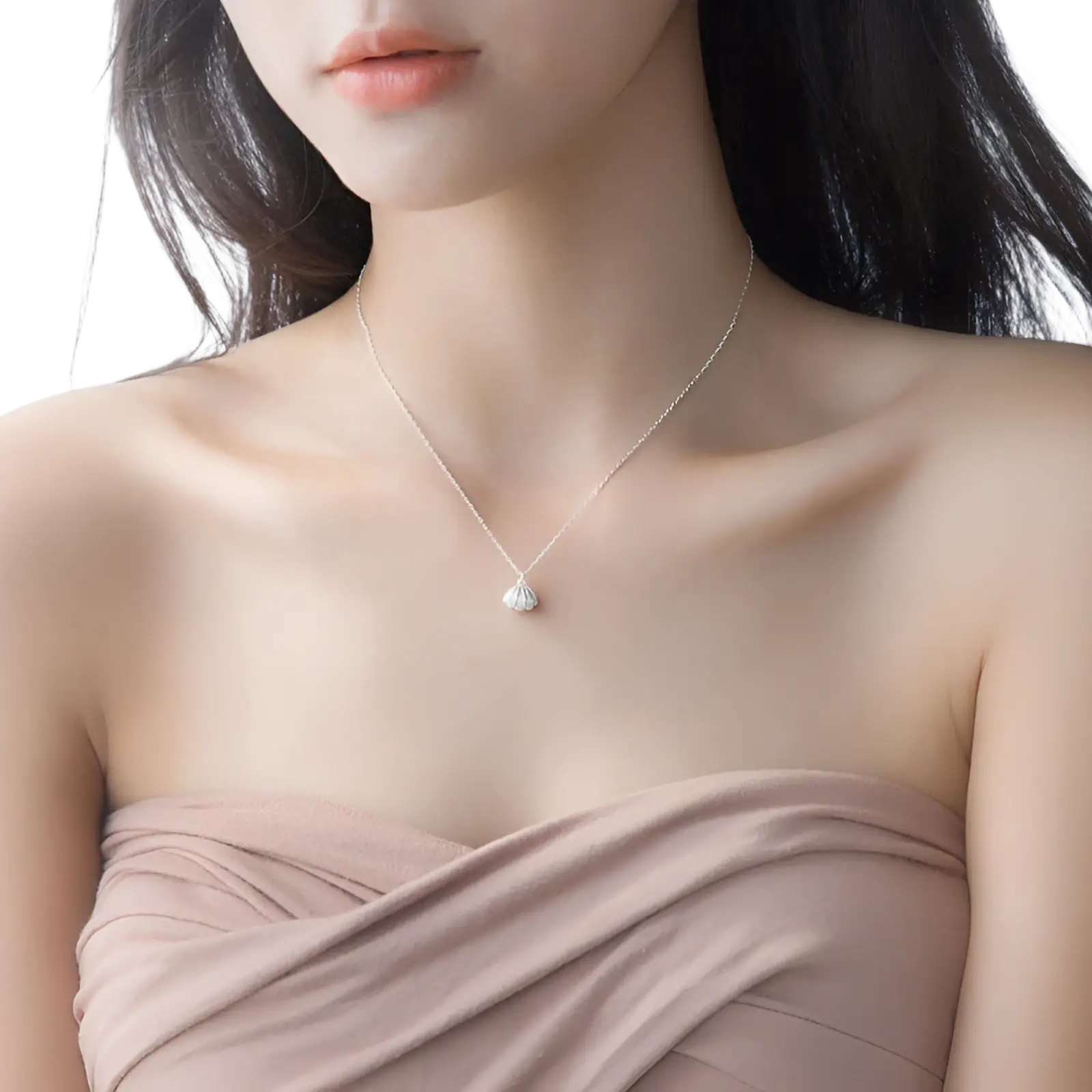 A delicate s925 silver chain necklace with a small sparkling silver shell pendant and pearl detail