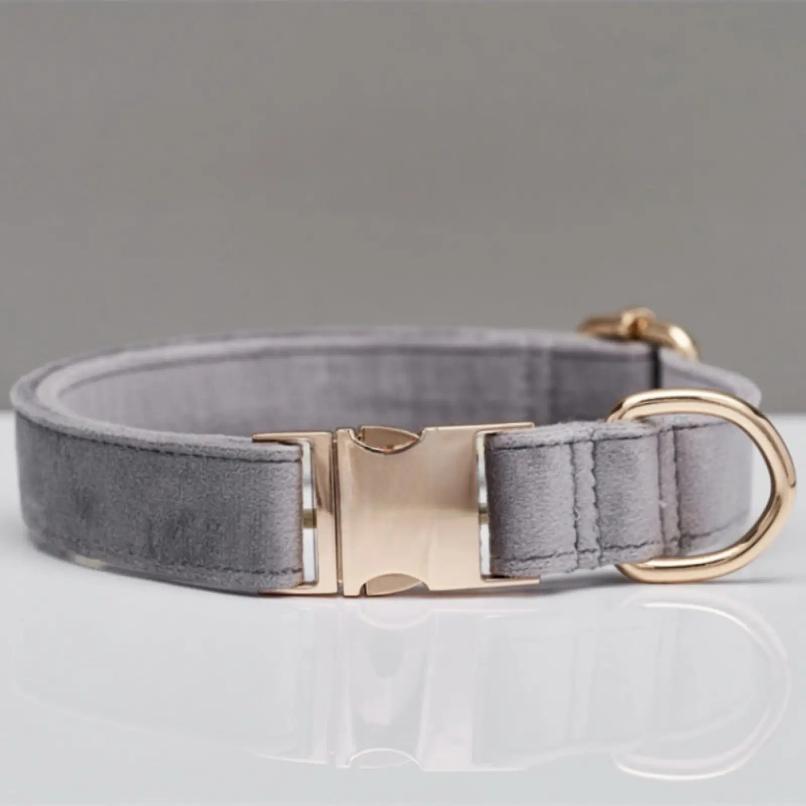 Gray suede personalized velvet dog collar with gold-tone metal buckle and d-ring featuring a bow detail