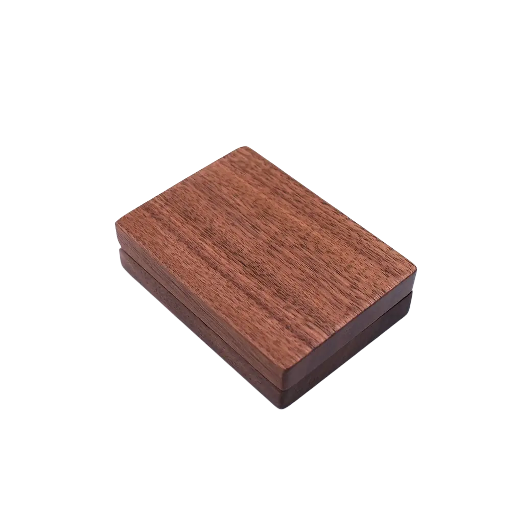 A personalized walnut wood wedding ring box with a rich warm brown finish and visible grain patterns