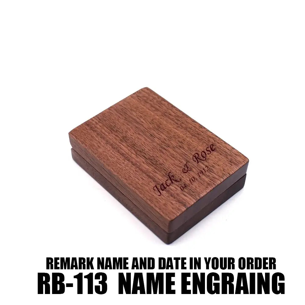 Personalized walnut wood wedding ring box in rich brown with smooth finish engraved with jack Rose and date 04.10.1912