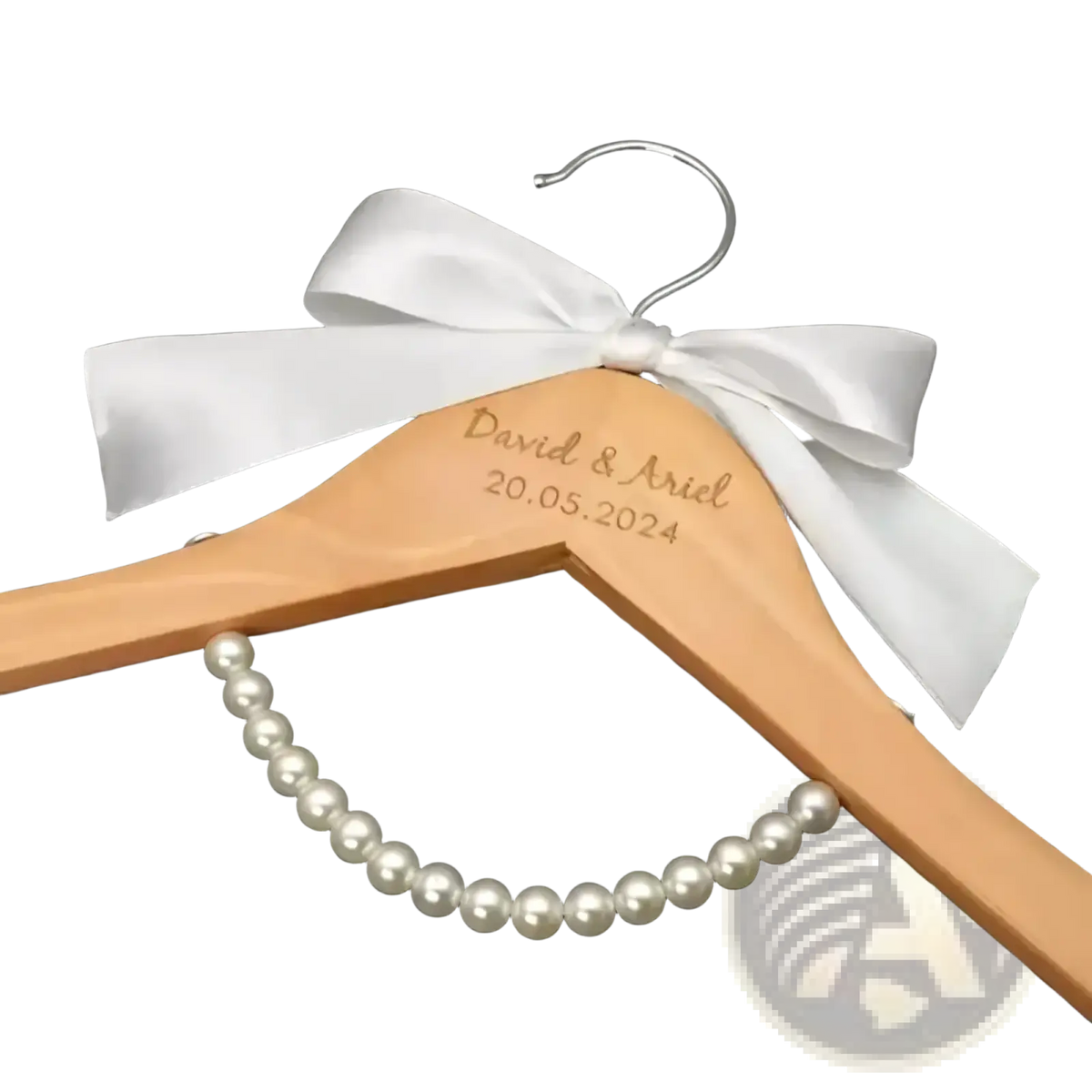 Personalized light wood wedding dress hanger engraved with names and date, adorned with white satin bow for bridal gift