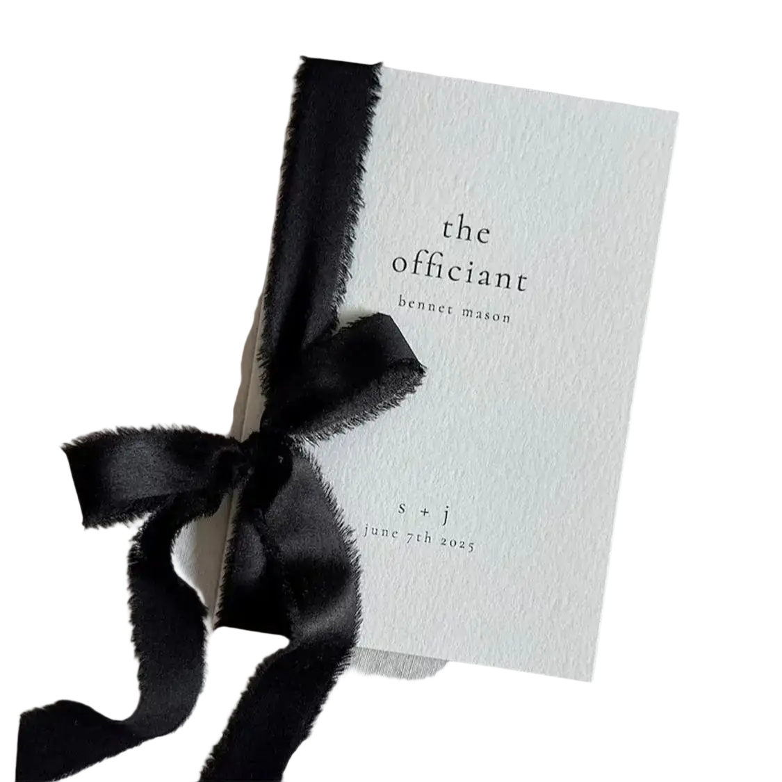 Minimalist white personalized wedding vow book with black text and frayed-edge black satin ribbon bow for his and her set