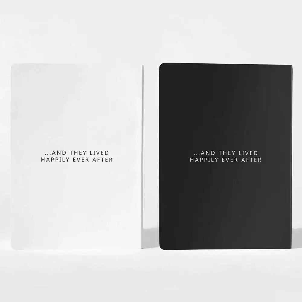 Minimalist black and white personalized wedding vow book with matte finish featuring centered phrase and they lived happily ever after