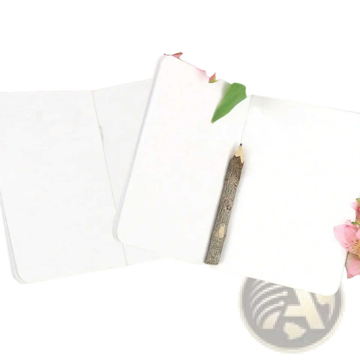 White personalized wedding vow books set with a rustic wooden pencil resting on open pages of the notebook