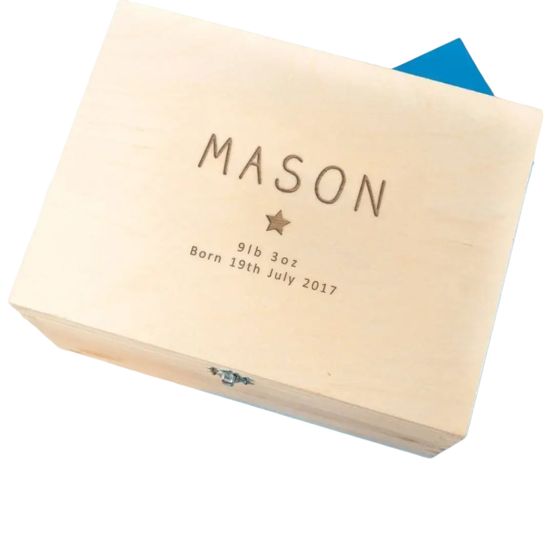 Light-colored wooden personalized baptism keepsake box with engraved name mason and birth details