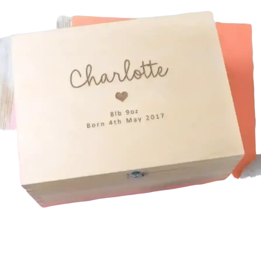 Light-colored wooden personalized baptism keepsake box engraved with name charlotte birth weight and date