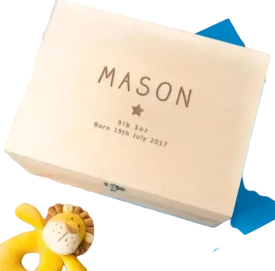 Light-colored wooden personalized baptism keepsake box engraved with name and birth details