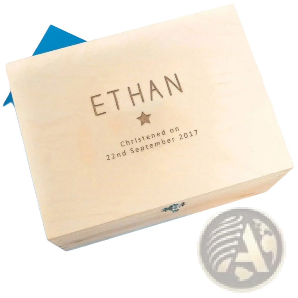 Light-colored wooden baptism keepsake box engraved with name Ethan date of christening and small star beneath name