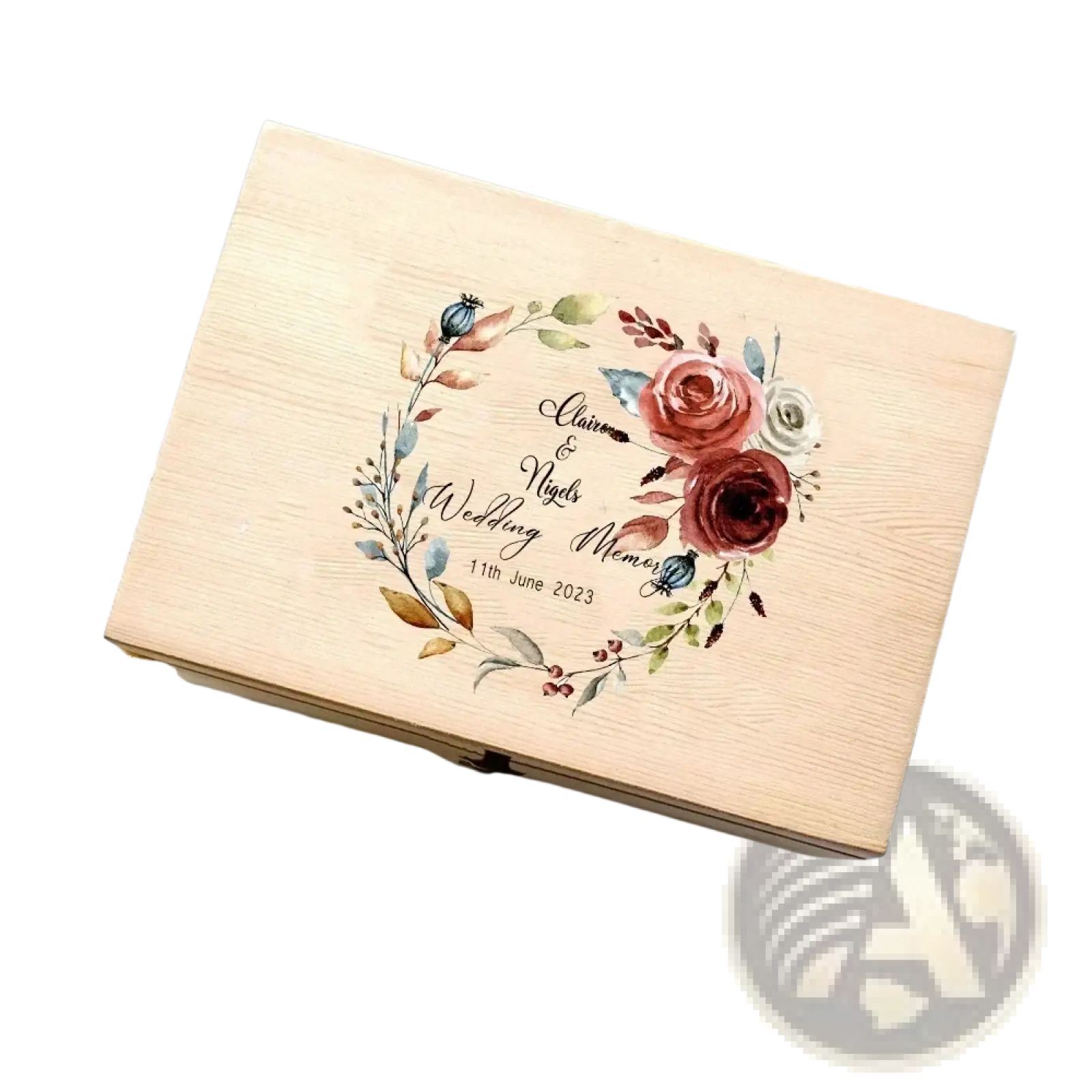 A light wood personalized wooden floral wedding memory box with watercolor floral wreath and engraved names and date