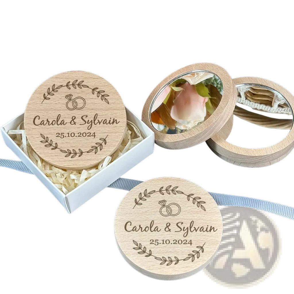 Light-colored wooden circular personalized pocket mirror engraved with wedding names date and leafy wreath design