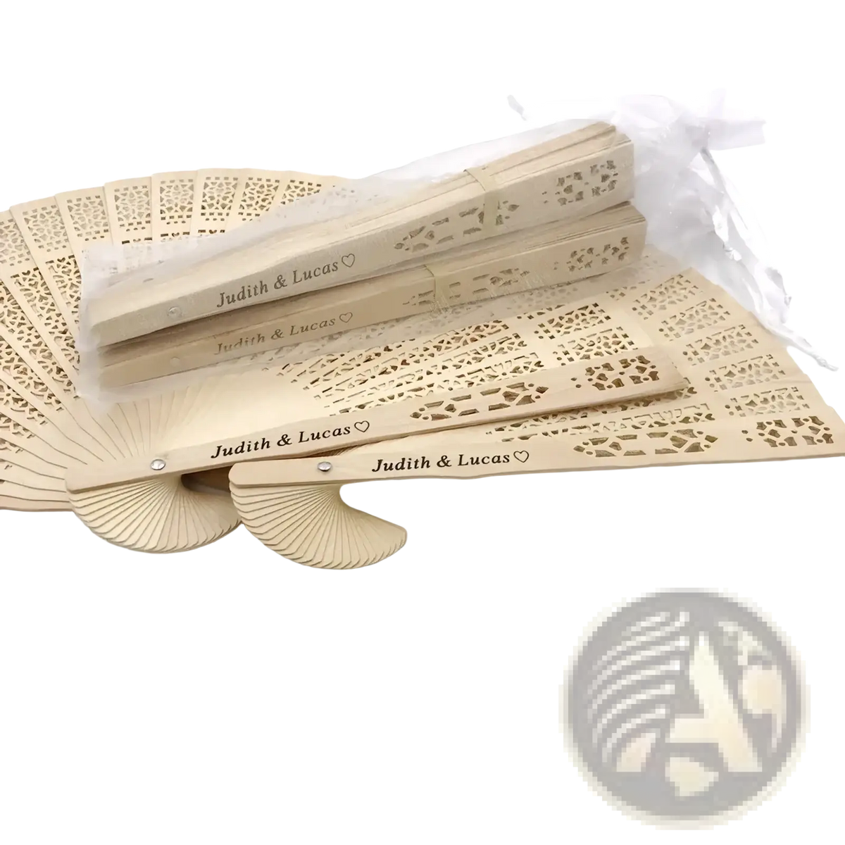 Beige personalized wooden wedding fans with intricate lace-like cutouts and engraved judith and lucas text on handles