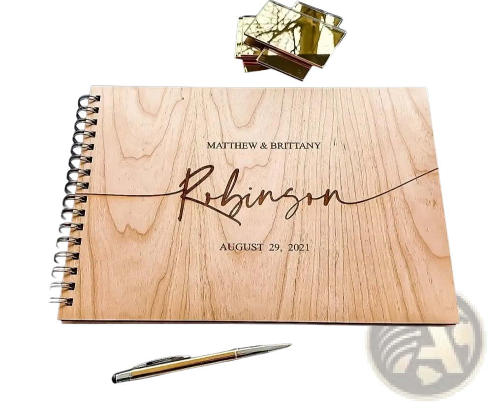 Personalized wooden wedding guest book album in light-colored wood with engraved names and date for wedding use