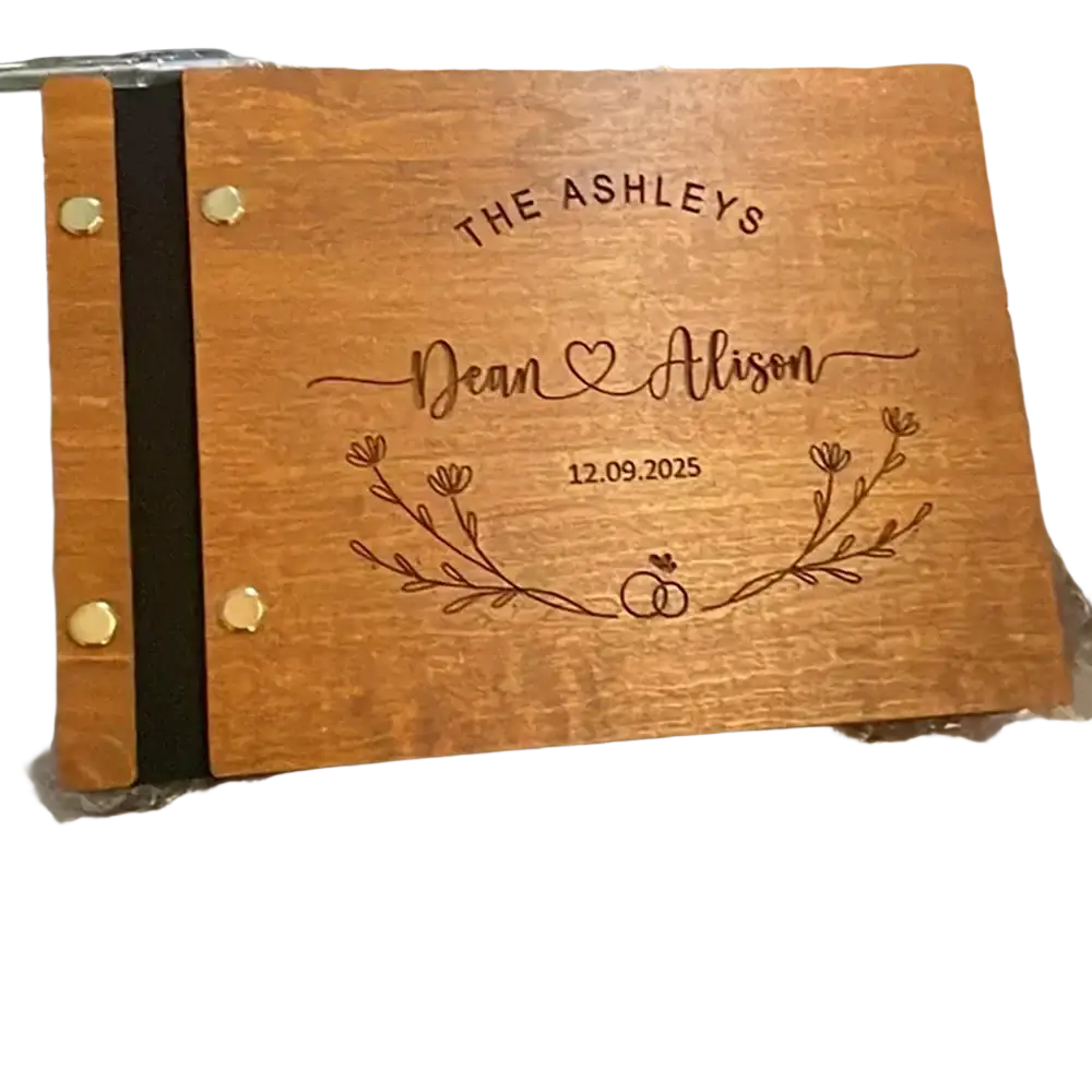 Personalized wooden wedding guest book engraved with names date and floral design for keepsake use