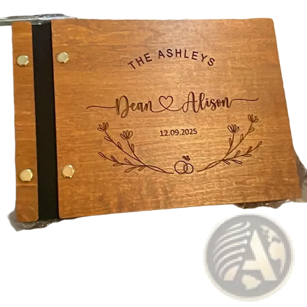 Personalized wooden wedding guest book engraved with names date and floral design for keepsake use