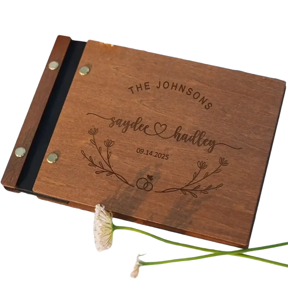 Personalized wooden wedding guest book with engraved names date and floral design in natural wood finish