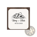 Personalized wooden wedding ring box with cream-colored square coaster featuring black mountain moon design and names henry olivia date 08.25.2025