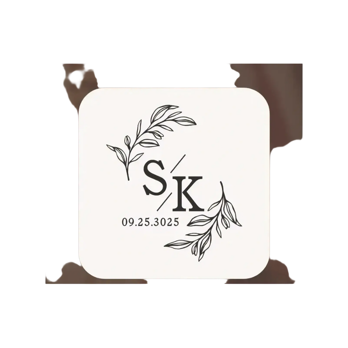 Cream-colored wooden wedding ring box coaster with black engraved sk monogram and date framed by leafy branches