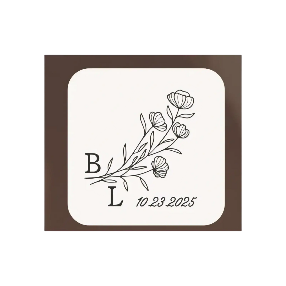 Cream-colored square wooden coaster with black floral line-art and personalized initials and date for wedding ring box