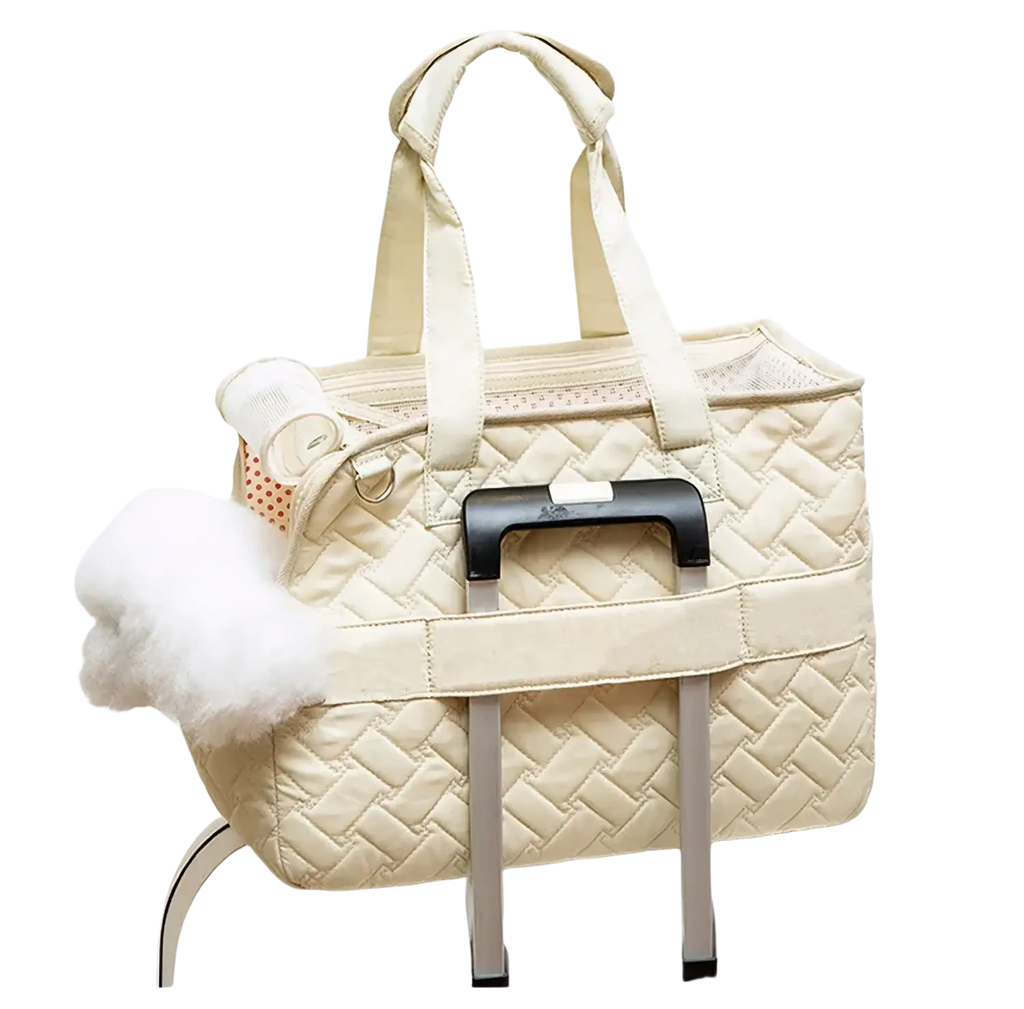 Cream-colored quilted pet bag small dog carrier with black retractable handle and white pom-pom accent breathable design