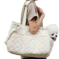 Cream-colored quilted pet bag with soft padded design and adjustable shoulder strap for small dog carrier use