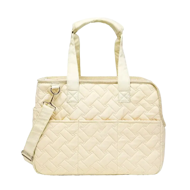 Cream-colored quilted pet bag with woven pattern and adjustable shoulder strap for small dog carrier use