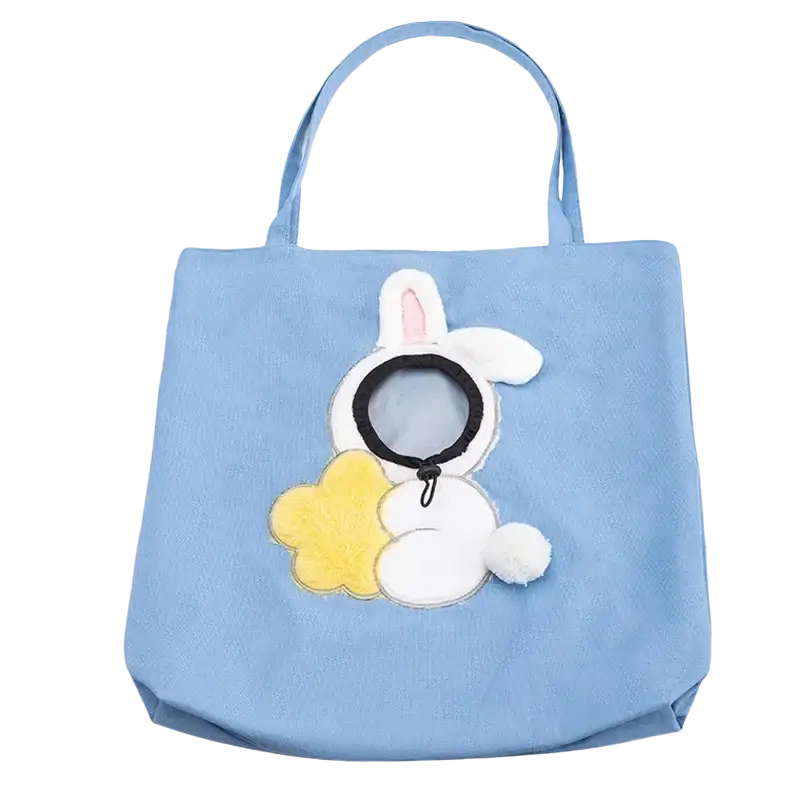 Light blue canvas pet carrier bag featuring a white plush bunny with pink ears holding a yellow cloud appliqué