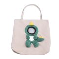 A soft green plush dinosaur with yellow spikes on a beige canvas carrier bag designed for small dog cat use