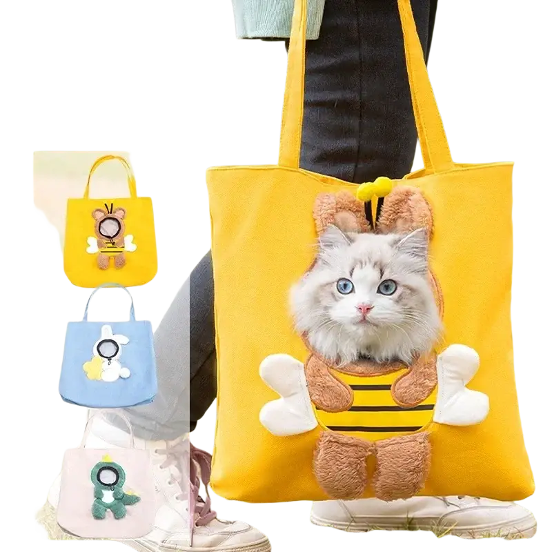 Yellow canvas pet carrier bag with fluffy white cat in plush bee costume peeking out front pocket mouth length
