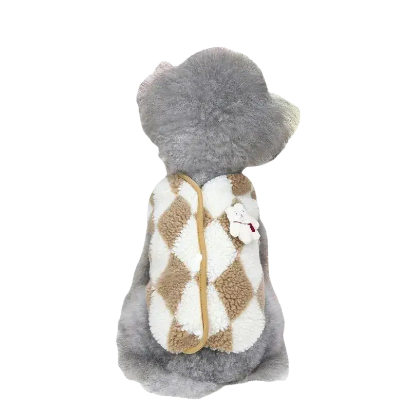 A cozy plush dog vest in cream and tan argyle pattern made of soft fleece for pet clothing use