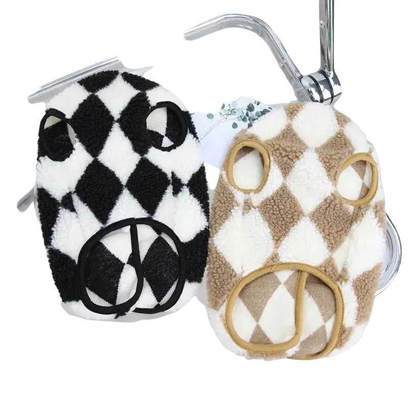 Two plush fleece puppy jumpsuits in black and white and beige with diamond pattern pet clothing for dogs