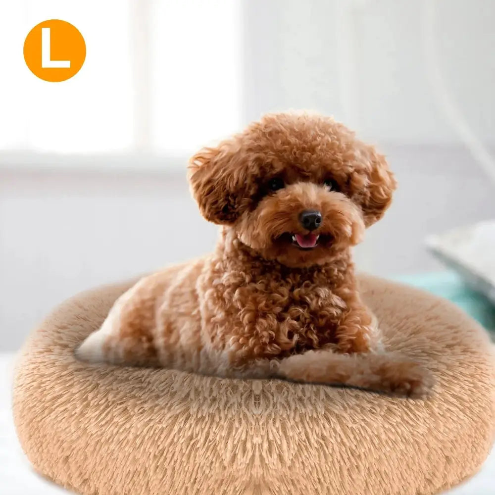 Plush fleece donut pet bed in fluffy tan designed for cats and small dogs for comfortable resting