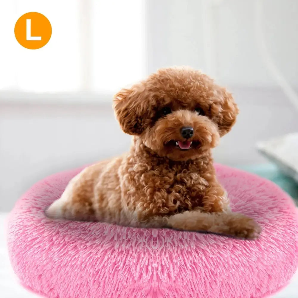 Plush fleece donut pet bed for cats and small dogs featuring a pink fluffy circular design and soft material