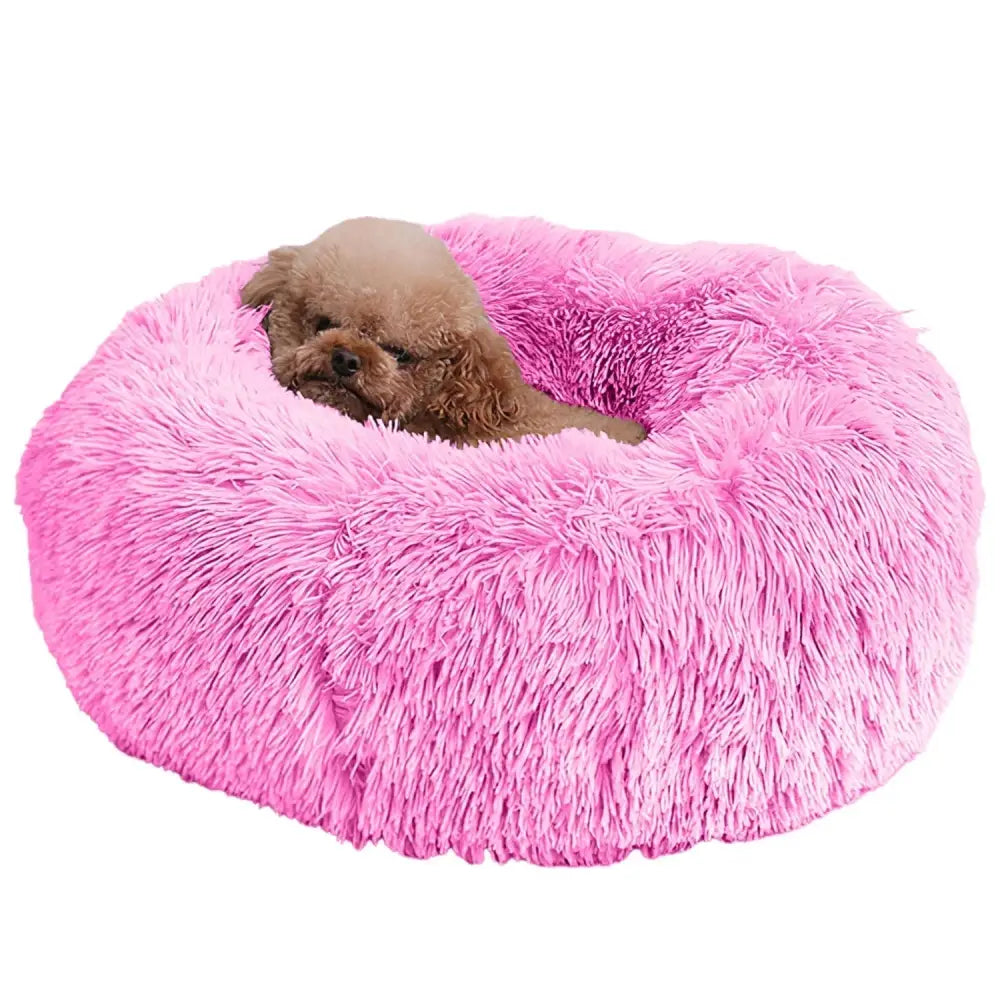 Plush fleece donut pet bed in pink featuring fluffy material designed for cats and small dogs
